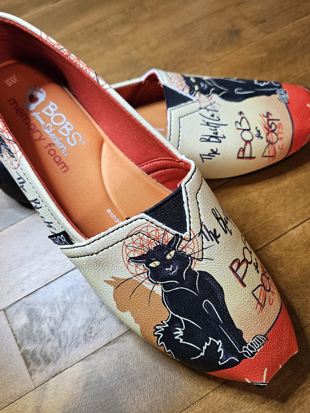 Skechers BOBS Cat Graphic Slip-On Flats in Cream, Black and Orange Halloween
